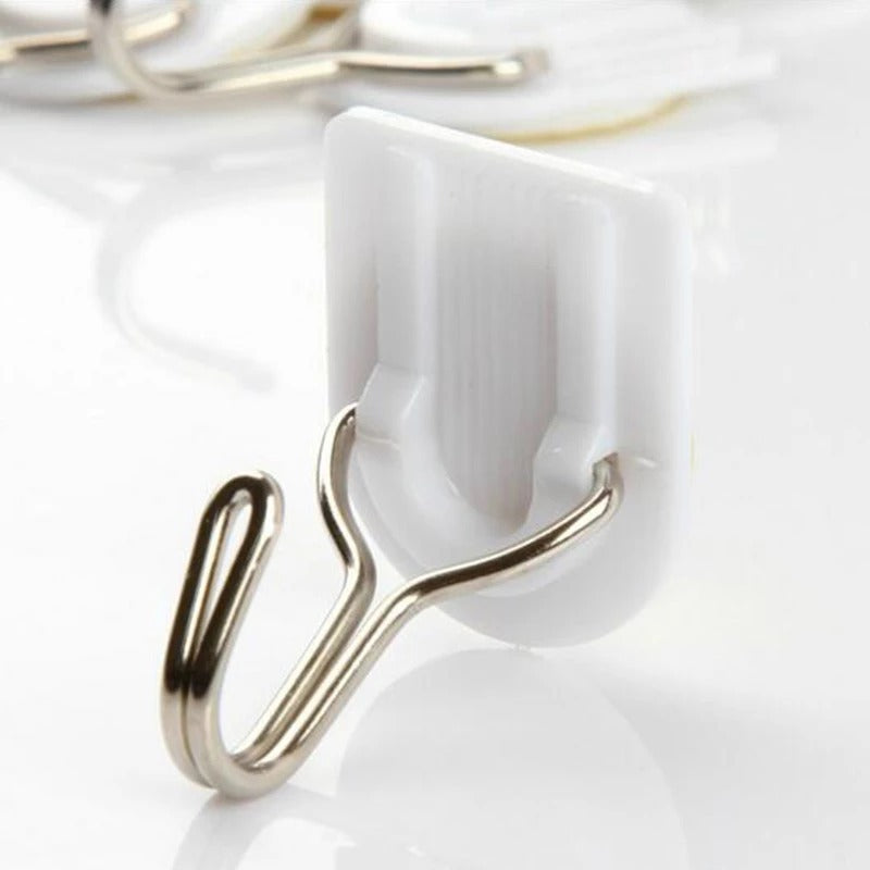 White plastic hook for hanging kitchen towels. White plastic hook for hanging kitchen towels.